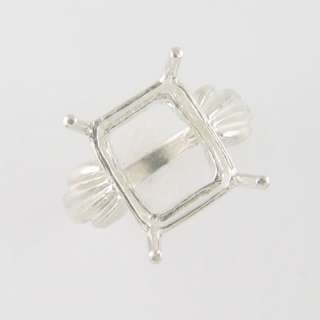 Designed for a 12x10 Millimeter Emerald Cut Center Stone that is 