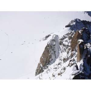 Climbers on a Snow Covered Mountains in the Dead of Winter in the Alps 