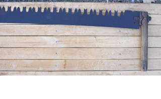 This auction is for a terrific antique crosscut saw Has its original 